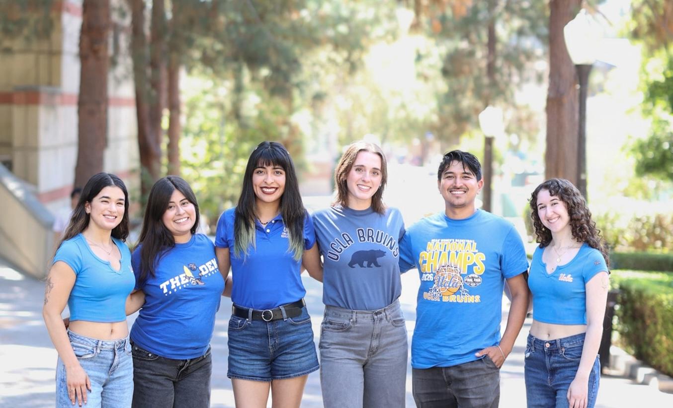 Group photo of UCLA graduate students dressed in blue