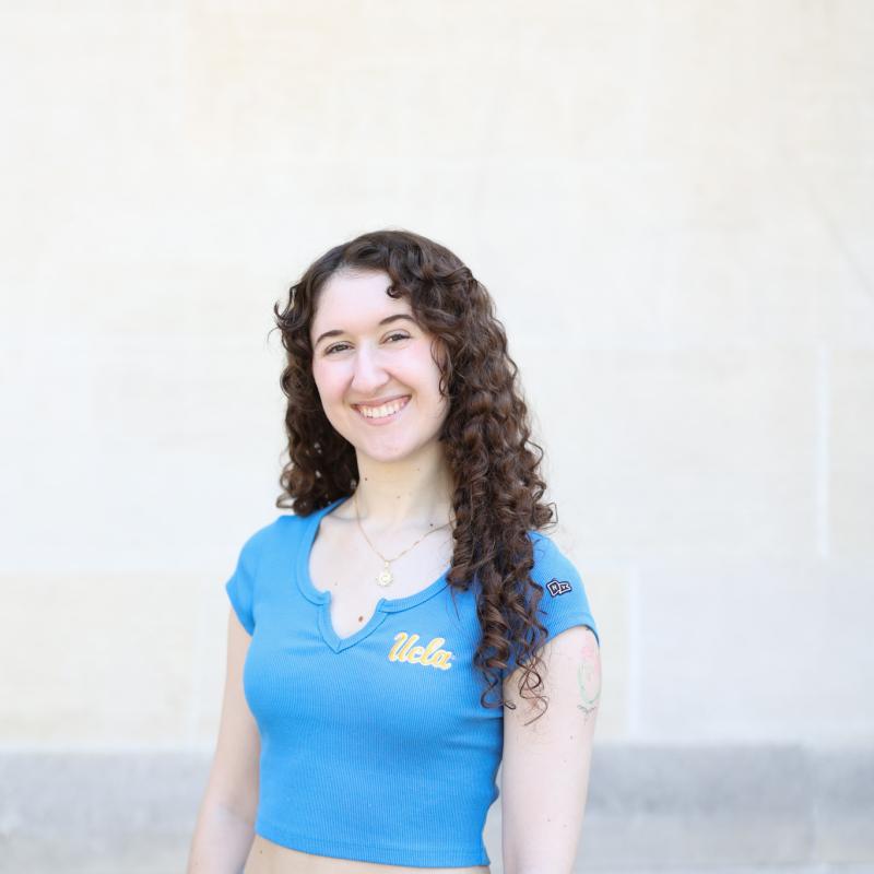 Photo of graduate student dressed in blue