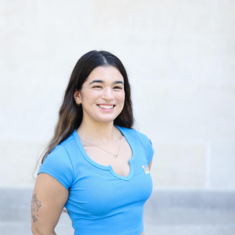 Photo of graduate student dressed in blue