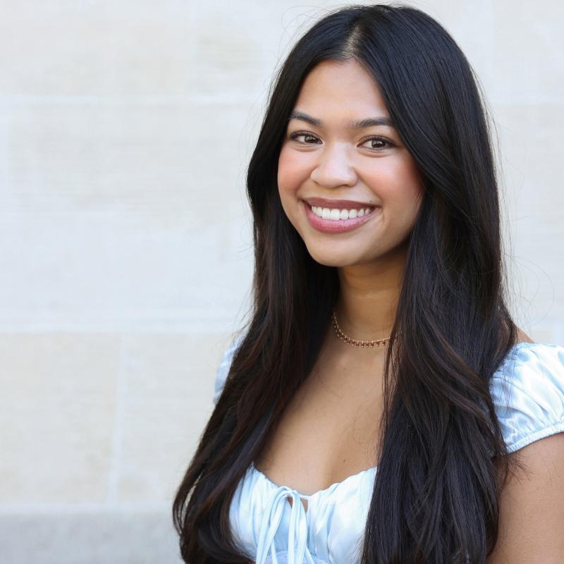 UCLA student wearing a blue shirt with a white background