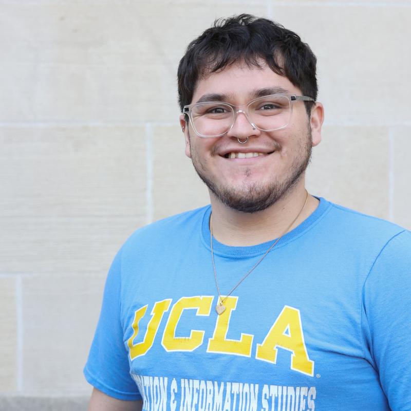 UCLA student wearing a blue shirt with a white background