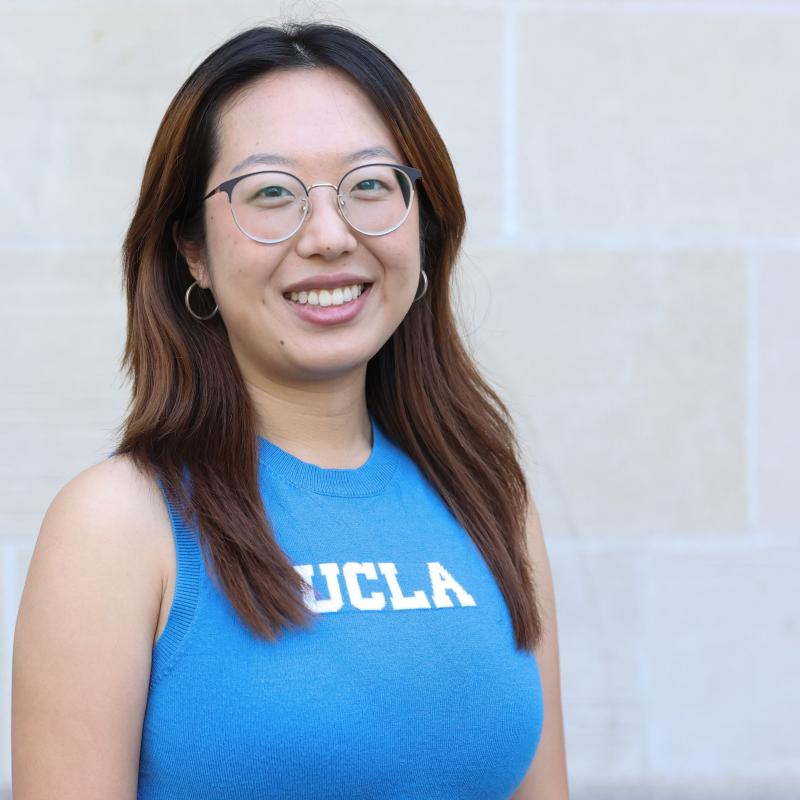 UCLA student wearing a blue shirt with a white background