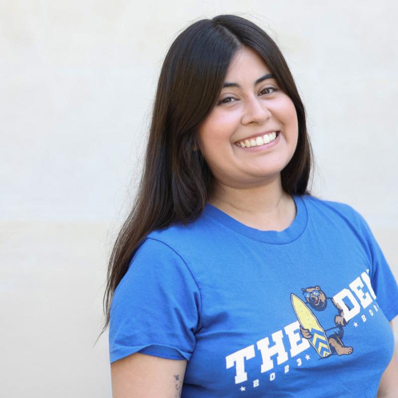 UCLA student wearing a blue shirt with a white background