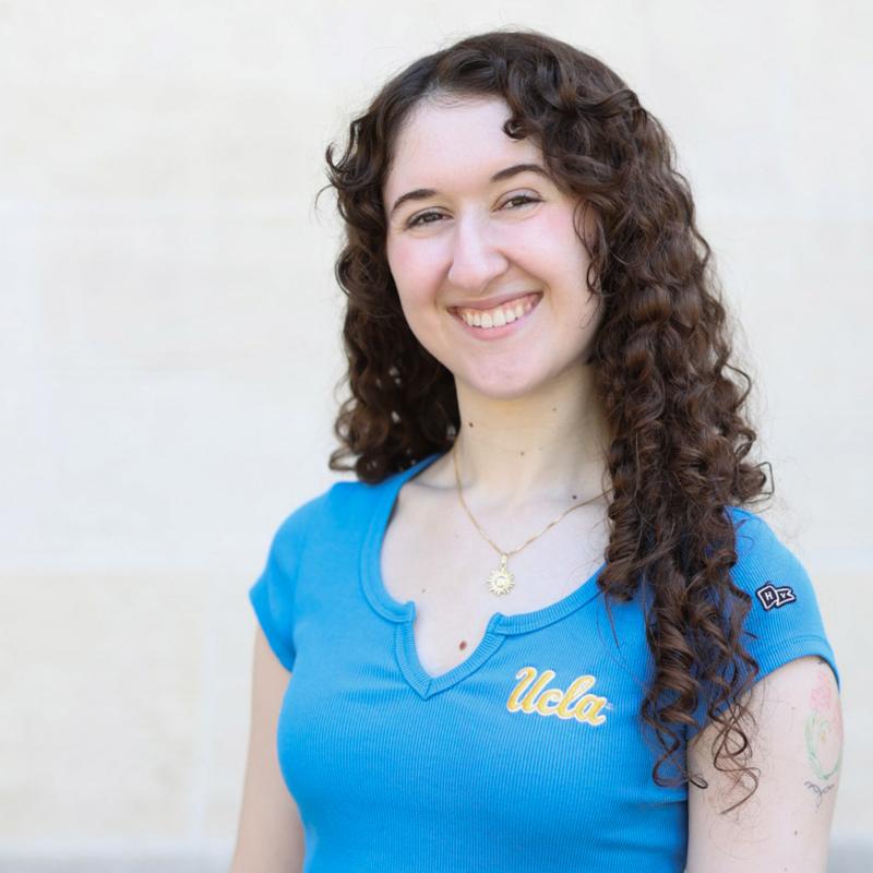 UCLA student wearing a blue shirt with a white background
