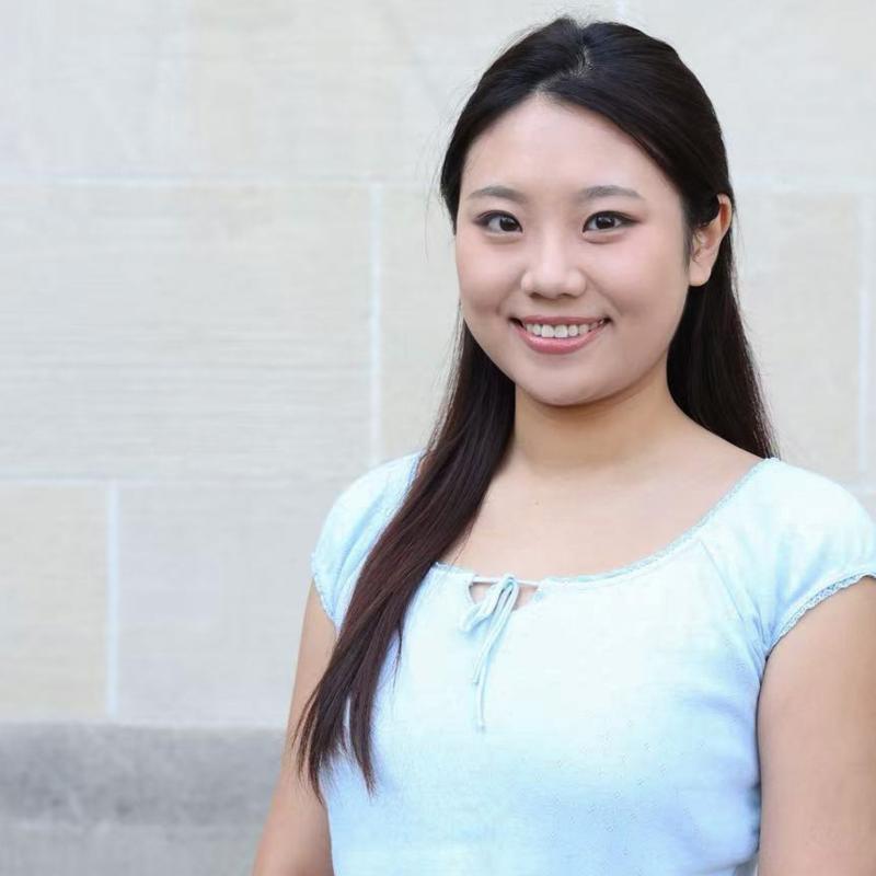 UCLA student wearing a blue shirt with a white background