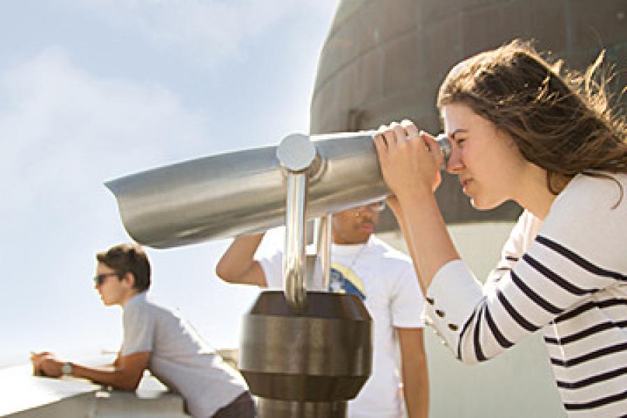 Person looking through binoculars